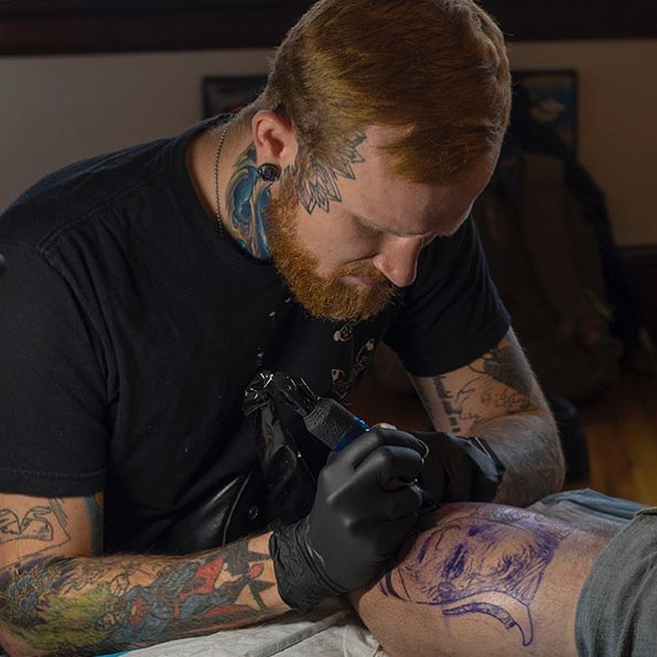 You are currently viewing Tattoo artist comfortable in his skin
